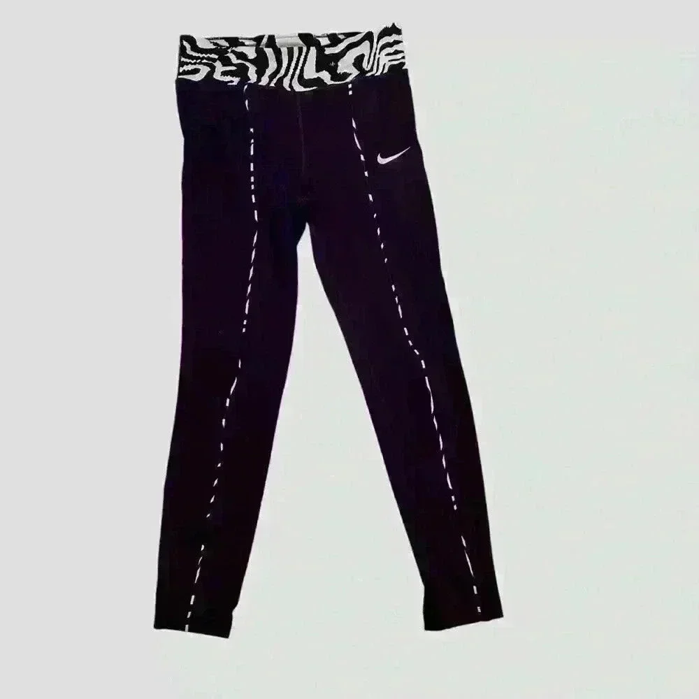 Nike Active pants size L in purple and green.